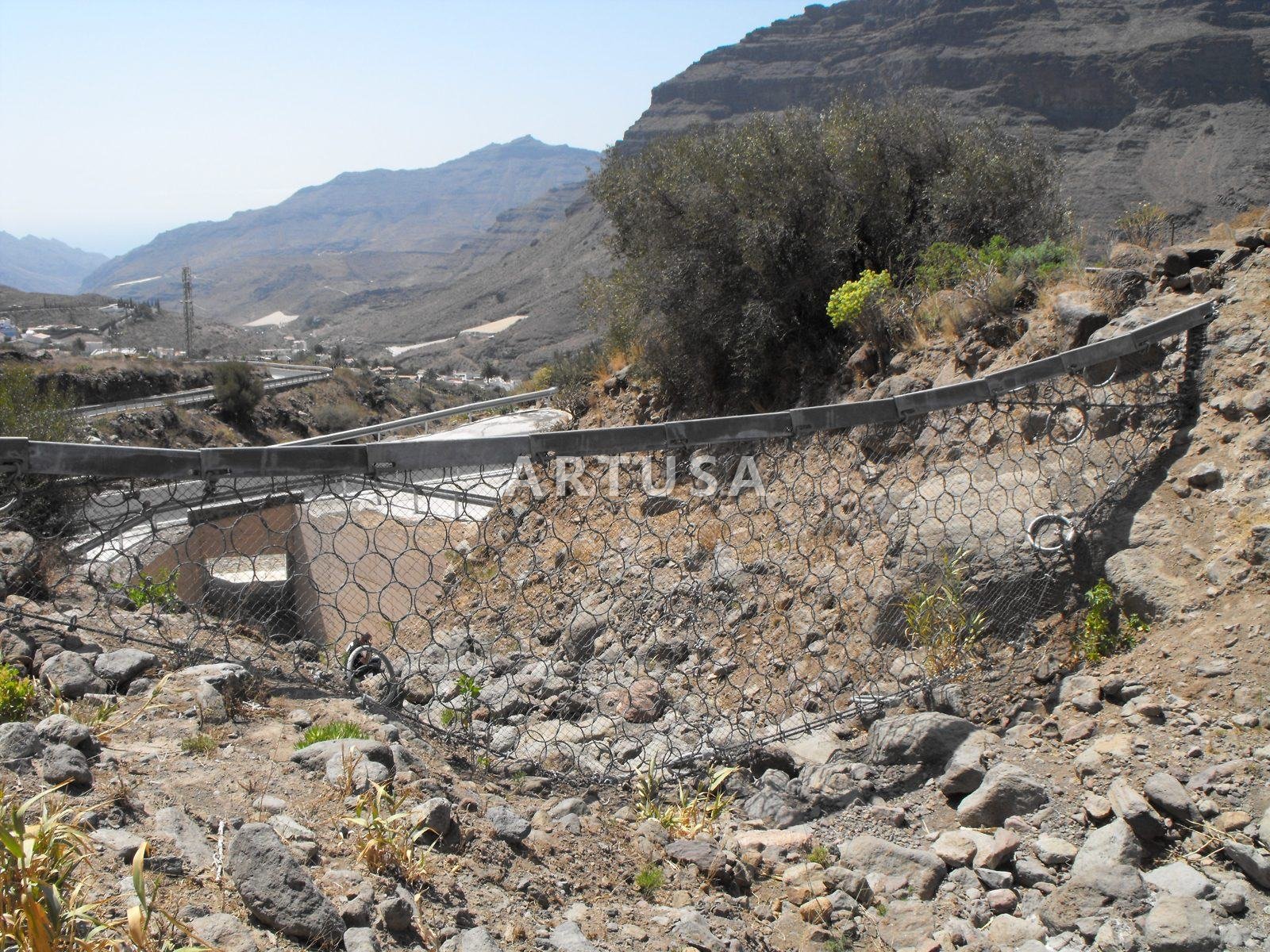Debris retention net above a culvert